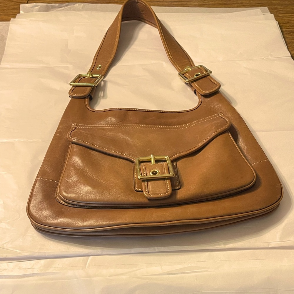Coach brand Warm brown purse with gold colored buckles